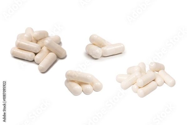 Fototapeta White pill capsule isolated on a white background.