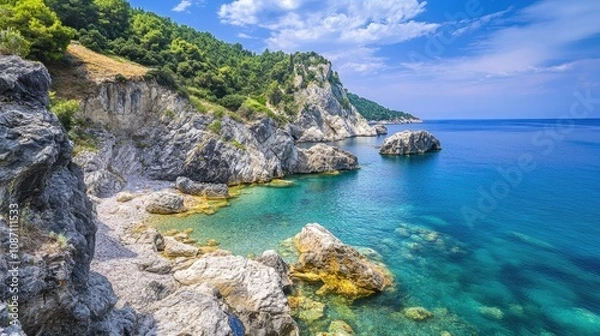 Fototapeta Scenic Coastal View with Diverse Rock Formations and Serene Blue Waters Under a Bright Sky