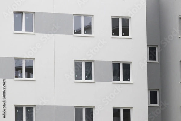 Fototapeta Multi-family apartment block with lots of windows