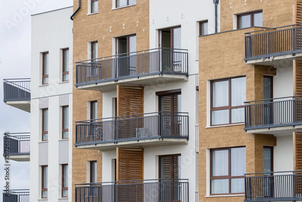 Fototapeta Multi-family apartment block with lots of windows