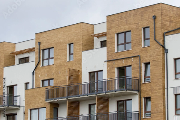 Fototapeta Multi-family apartment block with lots of windows