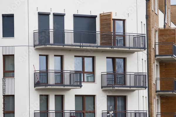 Fototapeta Multi-family apartment block with lots of windows