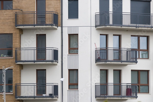 Fototapeta Multi-family apartment block with lots of windows