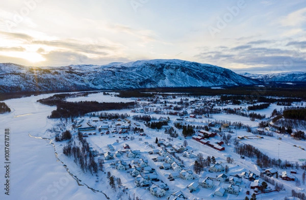 Obraz Alta, Norway. Aerial view of small northern town Alta, Norway in winter. Aerial with houses, river and mountain in the evening