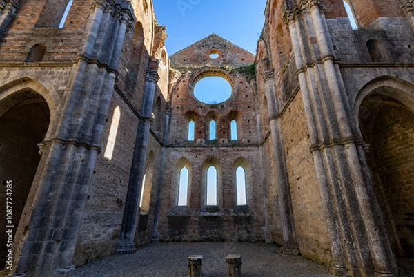 Fototapeta remains of San Galgano Abbey, a Cistercian monastery from the Middle Ages built in Chiusdino, a Tuscany countryside village in Central Italy