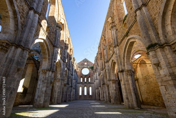 Fototapeta remains of San Galgano Abbey, a Cistercian monastery from the Middle Ages built in Chiusdino, a Tuscany countryside village in Central Italy