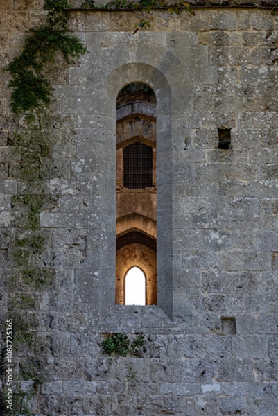 Fototapeta remains of San Galgano Abbey, a Cistercian monastery from the Middle Ages built in Chiusdino, a Tuscany countryside village in Central Italy
