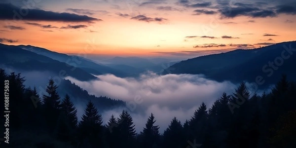 Obraz Sunset over misty mountain valley