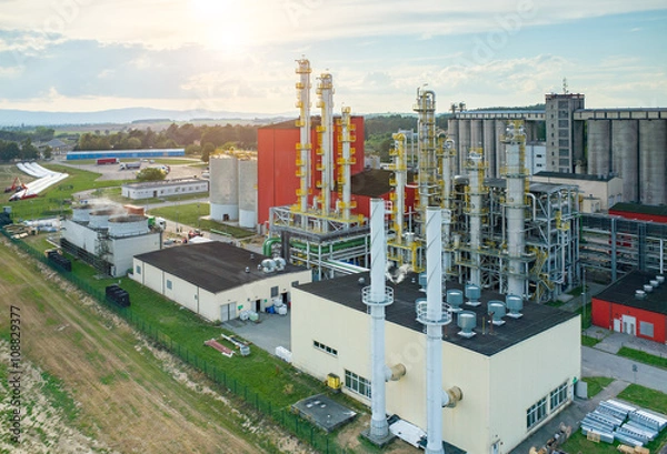 Obraz Sunset over biofuel factory