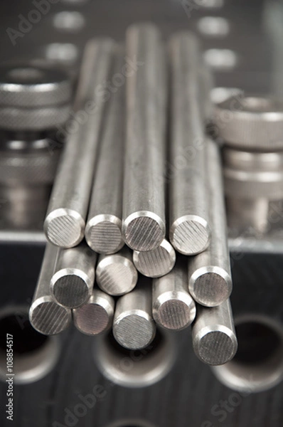 Obraz stainless steel rods on a welding table