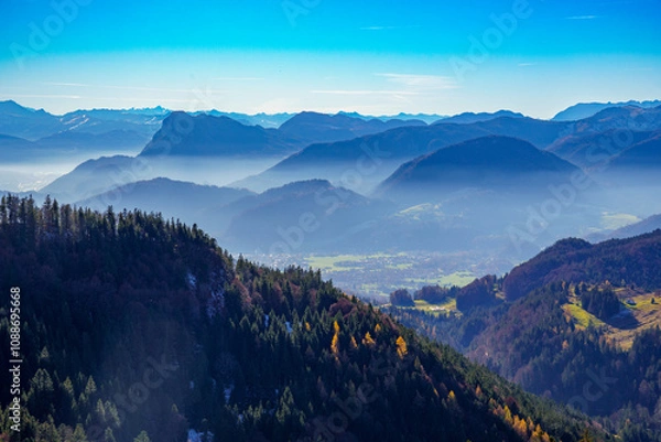 Fototapeta Mountains and valleys in the misty haze of the foothills of the Alps