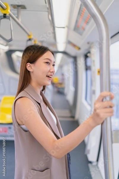 Fototapeta Asian Woman Commuting To Work By Skytrain