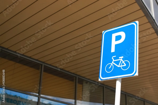 Fototapeta Bicycle parking sign on a background of the sky