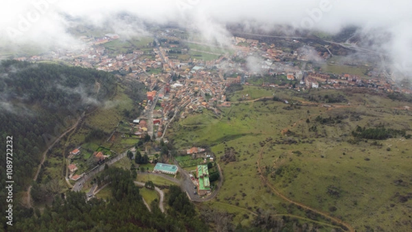 Fototapeta Cistierna, spain, surrounded by mountains and forests, seen from above