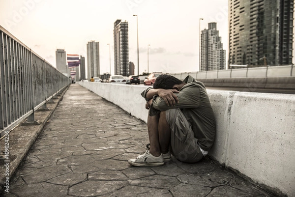 Fototapeta Men who despair of finding a job in the capital.