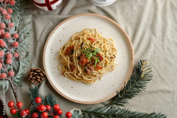 Obraz Festive pasta dish surrounded by Christmas decorations, capturing holiday vibes with lights, ornaments, and a cozy festive setting. Perfect for themes like Christmas food, holiday celebrations.