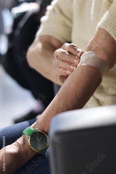 Obraz Close-up of a hand with a dressing after blood collection