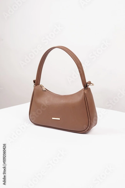 Fototapeta Women's luxury handbag, brown handbag purse, leather bag isolated on white background