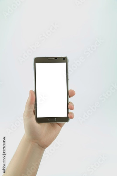 Fototapeta Big smartphone with empty blank display in hand isolated on the white background