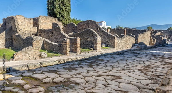 Fototapeta Empty cobblestone street in the ruins of Pompeji, Italy
