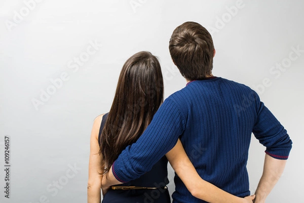Fototapeta  young couple standing back