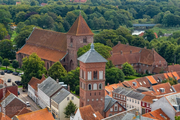 Fototapeta a panoramic city scape view form above on the rooftop of the cathedral of the small town ribe in denmark