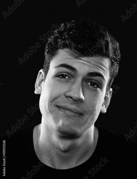 Obraz sarcastic young man studio portrait
