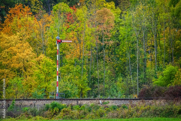 Fototapeta Czech railway mechanical signal on the background of the autumn forest