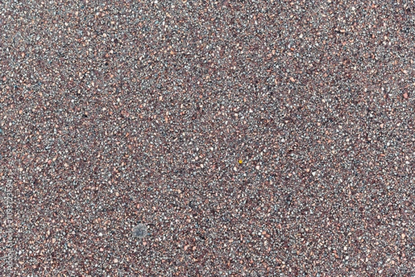 Fototapeta Fragment of the surface of an asphalt footpath. For use as abstract backgrounds and textures.
