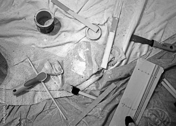 Obraz background close up of a messy floor filled with paint supplies for painting a room in a house