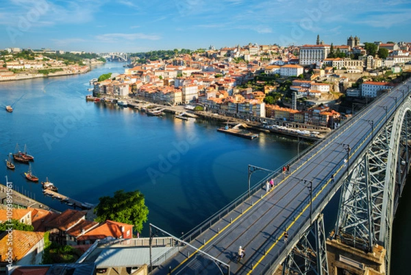 Fototapeta View of Porto city and Douro river and Dom Luis bridge I from famous tourist viewpoint Miradouro da Serra do Pilar on sunset. Porto, Vila Nova de Gaia, Portugal
