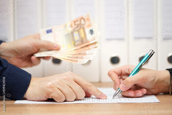 Fototapeta employer or businessman showing where to sign  in exchange to gi