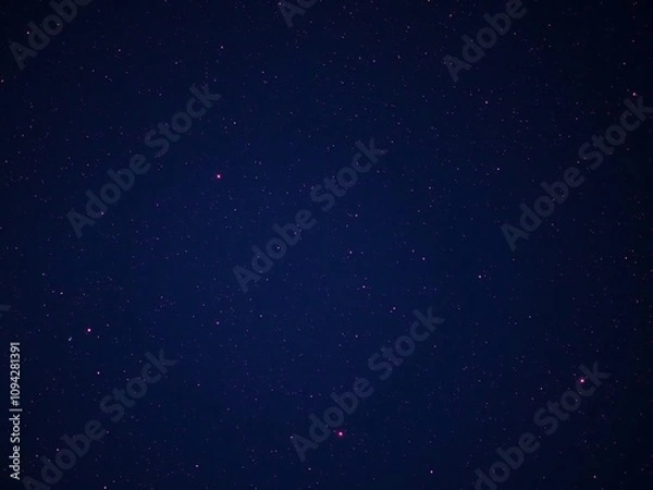 Fototapeta Deep blue cosmic background with red stars scattered across the sky at night time, fiery hue, starry night, dark blue