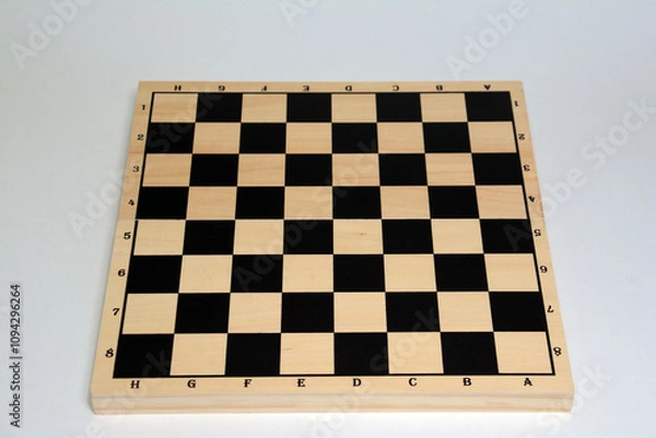 Fototapeta Chessboard. Chess game. Wooden chess on a plain background. Print set	