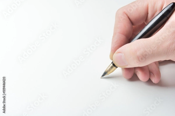 Obraz pen in the man's hand to signature