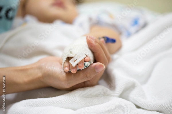 Fototapeta Mother holding a baby hand.