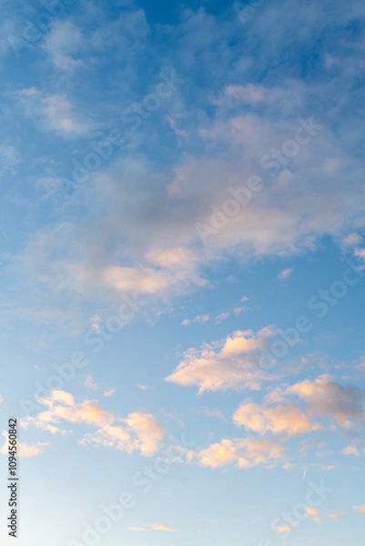 Obraz Blue sky and floating fluffy clouds with sunlight reflection