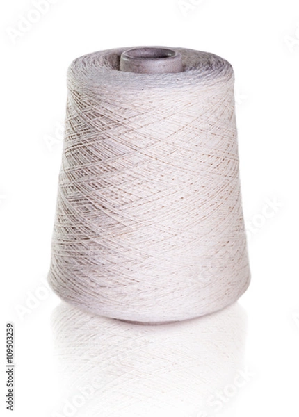 Fototapeta White bobbin of thread, isolated on white with a clipping path.