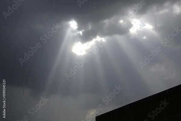 Fototapeta Rainy Day Rays breaking through dark clouds during a downpour cr