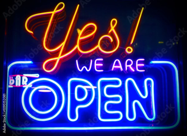 Obraz Yes, we're open - glowing neon sign board on glass window during night time