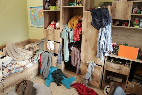 Fototapeta Scattered Things in Wardrobe, Disorder in Clothes. Childrens room is littered with clutter, clothes and things are scattered, Organizing Cleanliness
