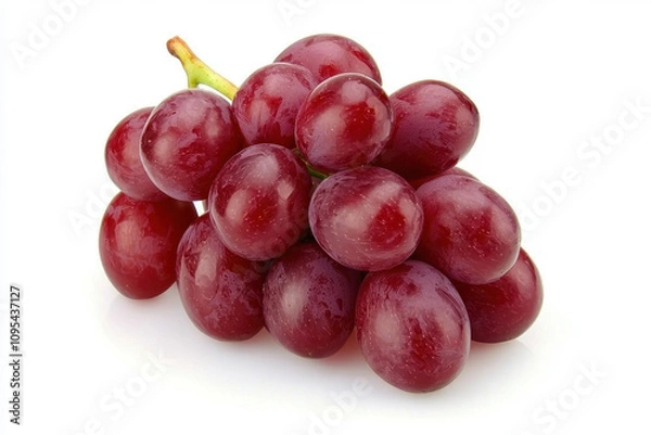Fototapeta A cluster of juicy crimson seedless grapes, glistening with a fresh sheen, stands out vividly against the stark simplicity of a clean white background, emphasizing their luscious texture & rich color