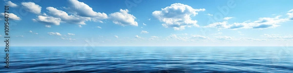 Fototapeta The vast expanse of the ocean stretches out before you, with nothing but the sky above and the gentle rocking of the waves below.