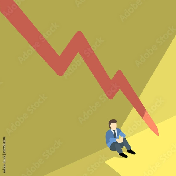 Fototapeta business man sitting alone against shadow wall with red arrow pointing downwards.