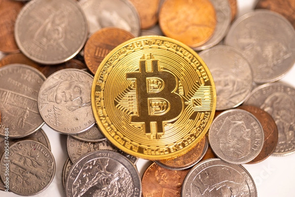 Fototapeta Bitcoin on a pile of American coins