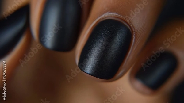 Fototapeta Close-up of manicured nails showcasing a matte black finish.