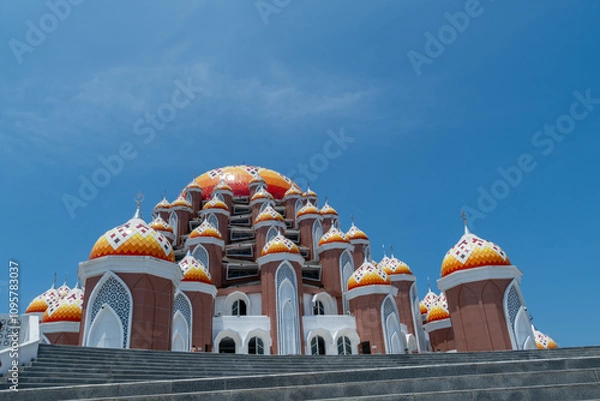 Fototapeta Close-up of the 99 Domes Mosque at Losari Beach, Makassar, on a cloudy morning. Beautiful landmark of Makassar City.