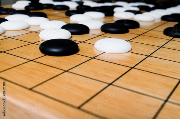 Obraz White go piece move toward corner