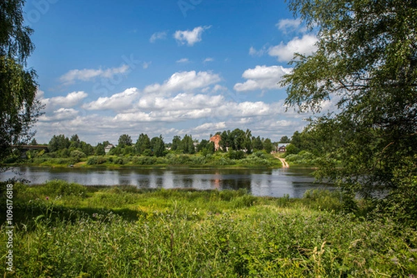 Fototapeta The Mologa River with a view of the Church of the Descent of the Holy Spirit (Dukhovskaya Church). Ustyuzhna. Vologda Oblast. Russia