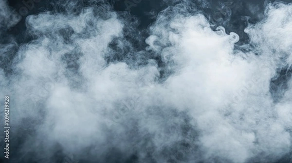 Fototapeta Dense white smoke swirls gracefully against a dark background, creating an ethereal and dramatic contrast in a close-up view.